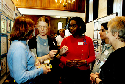 Several NEI women researchers deep in scientific discussion.