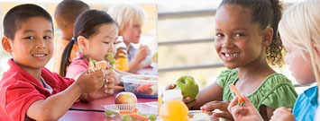 Niños comiendo un almuerzo saludable en una escuela primaria