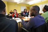 Image: Smart Communities staffers discuss over a meeting in Pilsen