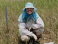 Photo of Virginia Schutte collecting data in the field.