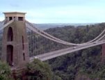 Highlights the Clifton Suspension Bridge, one of the earliest of its kind.