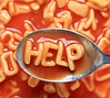 Alphabet soup letters spell HELP