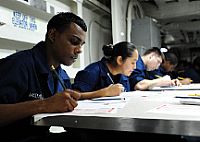 Aviation Structural Mechanic Airman Chrisen Maharaj takes the 3rd class petty officer advancement exam aboard the aircraft carrier USS Enterprise (CVN 65).