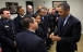 President Obama Is Presented A Challenge Coin By An Emergency Responder