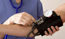 patient having their blood pressure checked