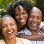 Photo: Adult woman hugging older parents