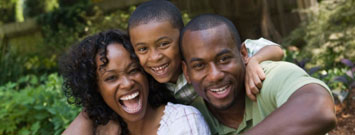 Photo: Family of three laughing
