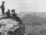 Photo of Four men are on Bright Angel Point overlooking Transept Canyon, Grand Canyon National Park, Arizona. Copyright restrictions applying to use or reproduction of this image available from the We