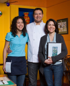 Photograph of a young Latina woman and her parents.