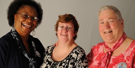 Three women smiling