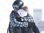 Bear hug: Locked in a tight embrace on the slopes of the Verbier ski resort yesterday, Prince Harry and his society girlfriend Cressida Bonas seem to be closer than ever