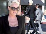 He must feel secure in himself! Brigitte Nielson, 49, towers over husband Mattia Dessi, 33, as they take sunshine stroll 