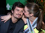 You're so cute! Miranda Kerr embraces her husband Orlando Bloom at the Global Green USA's 10th Annual Pre-Oscar Party