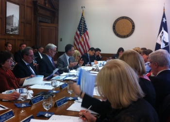 Bryson and participants seated at conference table