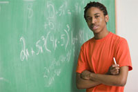 Photo: Student at chalkboard