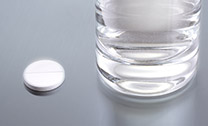 glass of water with one aspirin