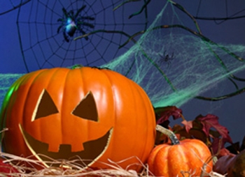 Image of jack-o-lantern, pumpkin and spider web