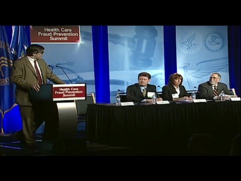 A panel of healthcare fraud professions presents at the Health Care Fraud Prevention & Enforcement Action Team (HEAT) regional summit in Chicago. The panel includes Ted Doyle, Vice President of Fraud Analytics at Optum Insight, Alanna Lavelle, Director of Investigations for Wellpoint, and Dr. Arnie Greenland of IBM and Dr. Ahmed Ghouri of Anvita Health.