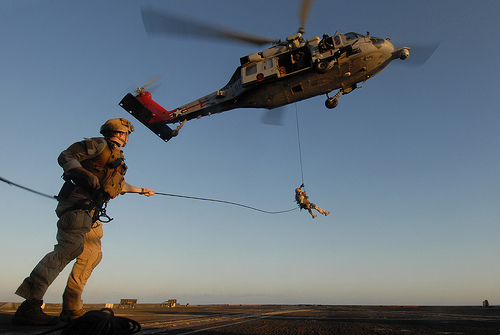 Image description: Sailors rappel from an MH-60S Sea Hawk helicopter during a training exercise aboard the guided-missile cruiser USS Gettysburg. HSC-9 and Gettysburg are conducting maritime security operations and support missions as part of operations Enduring Freedom and New Dawn.
Photo by Mass Communication Specialist 3rd Class Betsy Knapper, U.S.Navy
