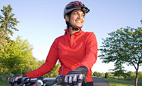 woman on bike wearing helmet