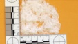 A quantity of crystal methamphetamine totaling 6.4 grams is displayed next to a ruler (File photo).