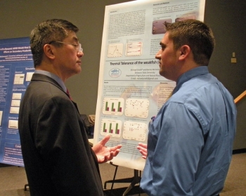 Secretary Locke Talks with a Student at NOAA's Science Center in Silver Spring, MD about His Research