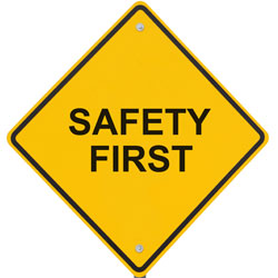 Image of a yellow sign that reads Safety First.
