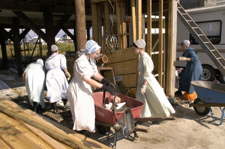 Grand Isle, LA 11-04-05 -- Mennonite Maria Rudolph from Hogetstown MD, and other Minnonite sisters loads trash for a Hurricane Katrina victim. Mennonite's from across the nation responded to the call of FEMA's Voluntary Agency Liaison for Vounteer help. MARVIN NAUMAN/FEMA photo 