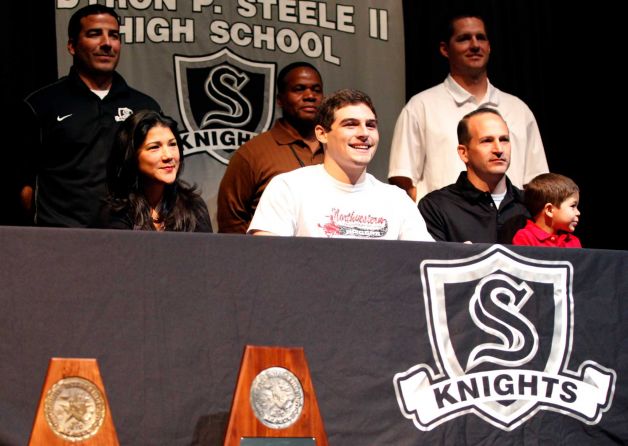 Steele High School  football player Garth Tubbs, in middle wearing white shirt, smiles Wednesday Feb. 6, 2013 after signing a letter of intent on National Signing Day to play football at Stetson University. Photo: William Luther, San Antonio Express-News / © 2013 San Antonio Express-News