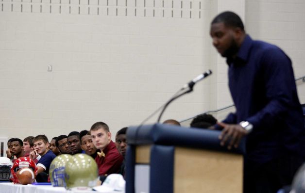 Fort Bend ISD students who committed to play football in college listen to  former George Bush High School student and current Seattle Seahawk NFL player Russell Okung speak, who also played at Oklahoma State University, during a signing day ceremony at the Buddy Hopson Field House Tuesday, Feb. 5, 2013, in Missouri City. Photo: Johnny Hanson, Houston Chronicle / © 2013  Houston Chronicle