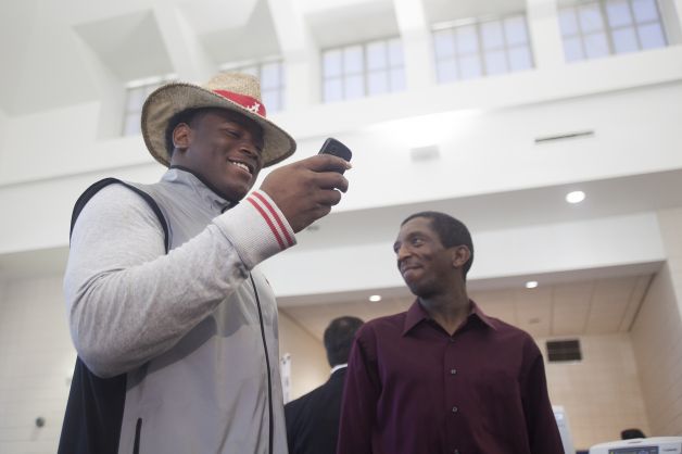 Reuben Foster sends a text message after announcing his intentions to attend the University of Alabama and play college football during National Signing Day on Wednesday, Feb. 6, 2013, in Auburn, Ala.  (AP Photo/Opelika-Auburn News, Albert Cesare) Photo: Albert Cesare, Associated Press / Opelika-Auburn News