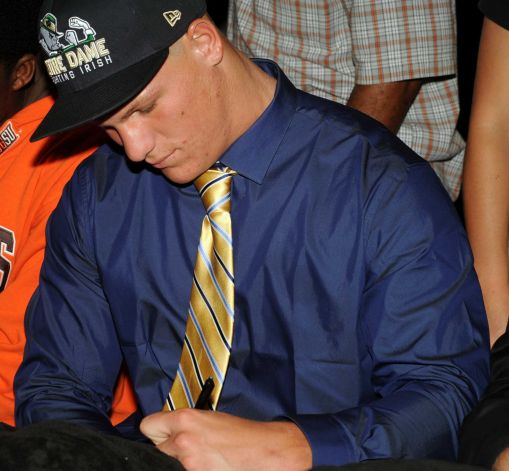 American Heritage Plantation's Michael Deeb signs his national letter of intent with Notre Dame on Wednesday, February 6, 2013, in Plantation, Florida. (Gary Curreri/Sun Sentinel/MCT) Photo: Gary Curreri, McClatchy-Tribune News Service / Sun Sentinel