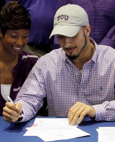 Nikki Luper watches her son, Cameron Echols-Luper, signs a letter of intent to attend TCU and play college football during National Signing Day on Wednesday, Feb. 6, 2013, in Auburn, Ala. (AP Photo/Butch Dill) Photo: Butch Dill, Associated Press / FR111446 AP