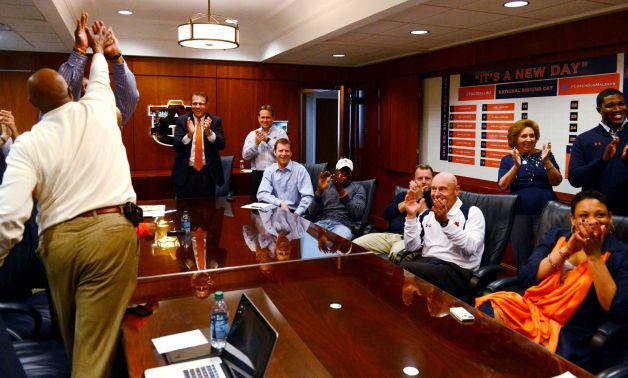 The Auburn coaching stafff reacts to watching Montravius Adams announced that was signing with the Tigers to attend Auburn and play NCAA college football on national signing day on Wednesday, Feb 6, 2013 in Auburn, Ala. Auburn coach Gus Malzahn is standing center.(AP Photo/Todd J. Van Emst) Photo: Todd J. Van Emst, Associated Press / FR8775 AP