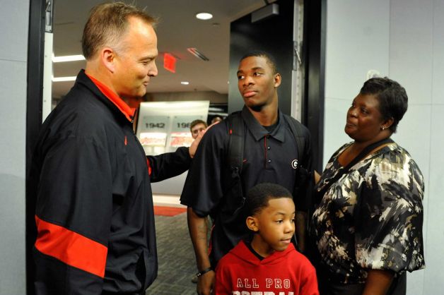Georgia head coach Mark Richt, left, greets Reggie Wilkerson and family after a national signing day news conference in Athens, Ga., Wednesday, Feb. 6, 2013. (AP Photo/The Athens Banner-Herald, AJ Reynolds)   MAGS OUT; MANDATORY CREDIT Photo: AJ Reynolds, Associated Press / OnlineAthens & The Athens Banner