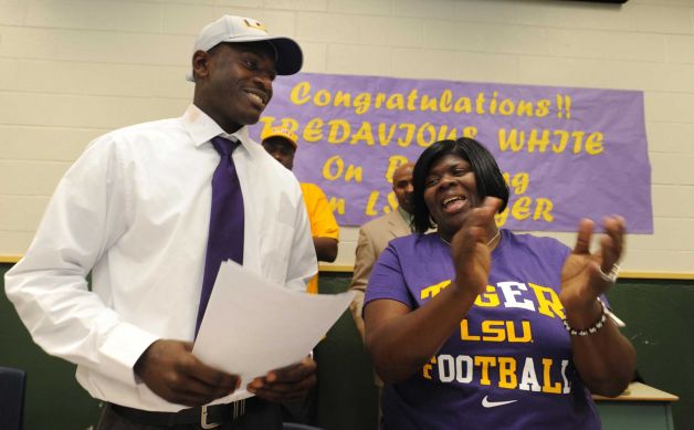 Tre'Davious White and his mother, LaShawnita Ruffins, smile after he signed a letter of intent to attend LSU and play college football during national signing day, Wednesday, Feb. 6, 2013 at Green Oaks High School in School in Shreveport, La. (AP Photo/The Shreveport Times, Jim Hudelson) MAGS OUT; MANDATORY CREDIT SHREVEPORTTIMES.COM Photo: Jim Hudelson, Associated Press / The Shreveport Times