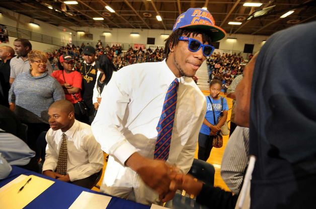 Daniel McMillian showed up at First Coast High School's National Signing Day ceremony  to be with his former teammates after already enrolling at the University of Florida, , Wednesday, Feb. 6, 2013, in Jacksonville, Fla.    (AP Photo/The Florida Times-Union, Bob Self) Photo: Bob Self, Associated Press / The Florida Times-Union