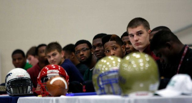 Fort Bend ISD students who committed to play football in college listen to  former George Bush High School student and current Seattle Seahawk NFL player Russell Okung speak, who also played at Oklahoma State University, during a signing day ceremony at the Buddy Hopson Field House Tuesday, Feb. 5, 2013, in Missouri City. Photo: Johnny Hanson, Houston Chronicle / © 2013  Houston Chronicle