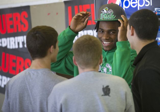 Jaylon Smith, a linebacker from Bishop Luers, talks with friends before signing a letter of intent with Notre Dame on Wednesday, Feb. 6, 2013, in Fort Wayne, Ind. (AP Photo/The Journal-Gazette, Swikar Patel) NEWS-SENTINEL OUT  MAGS OUT  NO SALES Photo: Swikar Patel, Associated Press / The Journal-Gazette