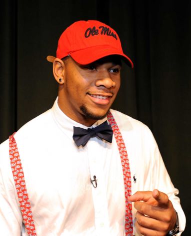 Grayson High School football player Robert Nkemdiche, the nation's top recruit, announces his intent to play college football for Ole Miss during a signing day ceremony at his high school auditorium in Grayson, Ga., Wednesday Feb. 6, 2013. (AP Photo/David Tulis) Photo: Dave Tulis, Associated Press / FR170493 AP