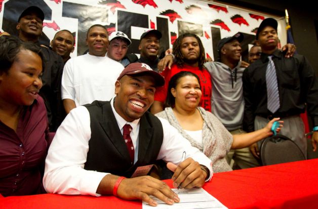 Texas A&M signee Hardreck Walker is all smiles during a National Letter of Intent signing ceremony at Westfield High School Wednesday, Feb. 6, 2013, in Houston. Photo: Brett Coomer, Houston Chronicle / © 2013 Houston Chronicle