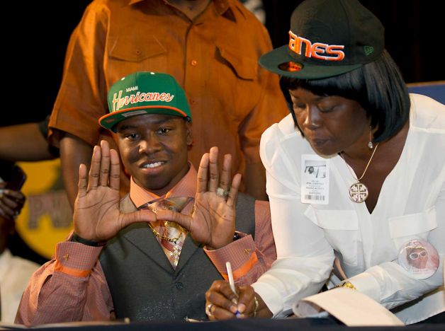 Miramar High's Jermaine Grace forms the U after announcing he was signing with the University of Miami in Miramar, Florida, Wednesday, February 6, 2013. (Joe Rimkus Jr./Miami Herald/MCT) Photo: Joe Rimkus Jr., McClatchy-Tribune News Service / Miami Herald