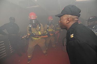 Sailors assigned to Repair Locker 3 fight a simulated fire during a general quarters drill aboard the aircraft carrier USS Theodore Roosevelt (CVN 71) as part of a bi-monthly readiness exercise. The purpose of the exercise is to train Sailors to safely fight the ship as Theodore Roosevelt prepares to rejoin the operational fleet.  U.S. Navy photo by Mass Communication Specialist 3rd Class Brian G. Reynolds (Released)  130122-N-ED185-036