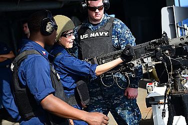 Aviation Ordnanceman Airman Shalynn Claudio, assigned to the aircraft carrier USS Theodore Roosevelt (CVN 71), loads a .50-caliber machine gun during a live fire training exercise aboard the aircraft carrier USS George H.W. Bush (CVN 77). George H.W. Bush is conducting training and carrier qualifications in the Atlantic Ocean.  U.S. Navy photo by Mass Communication Specialist 3rd Class Kevin J. Steinberg (Released)  130130-N-TB177-065