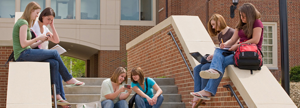 College students sitting on steps