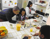 African American family preparing breakfast