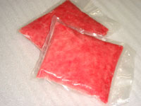 Two packages of raw scraped ground tuna.