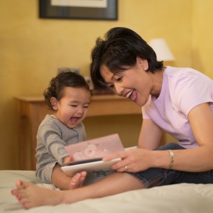 Mother reading book to child