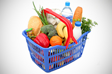Grocery basket filled with food items.