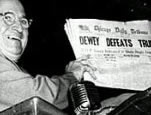 President Truman holding Nov. 3, 1948 edition of 'Chicago Daily Tribune' with a headline that proclaims 'Dewey Defeats Truman.'